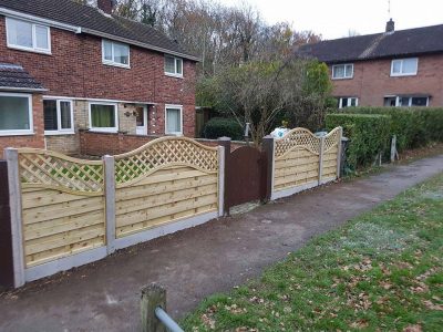 curved fence nested in a concrete gravel board kettering