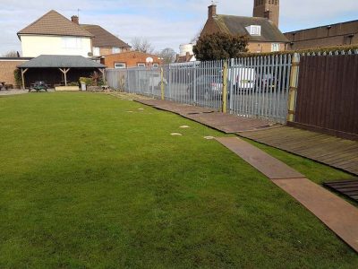 beer garden fence installation feathered edge and concrete gravel boards in front of a security fence for looks and efficiency