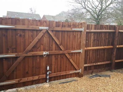 dark wood timber feathered edge two door french style gate with bottom locking