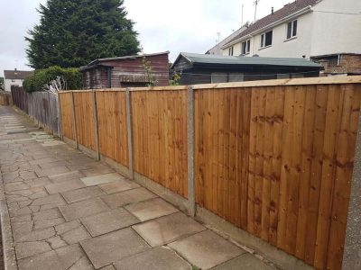 feathered edge fence with timber gravel boards along back garden in corby northamptonshire