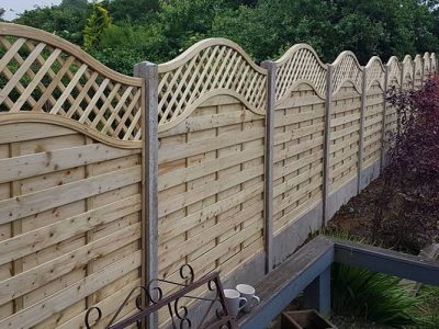 Residential fencing with curved top installed in Corby