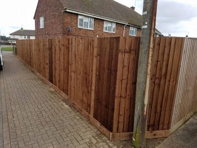 corner fence installation avoiding a telephone pole in corby norhtamptonshire using a feathered edge styled fencing soloution